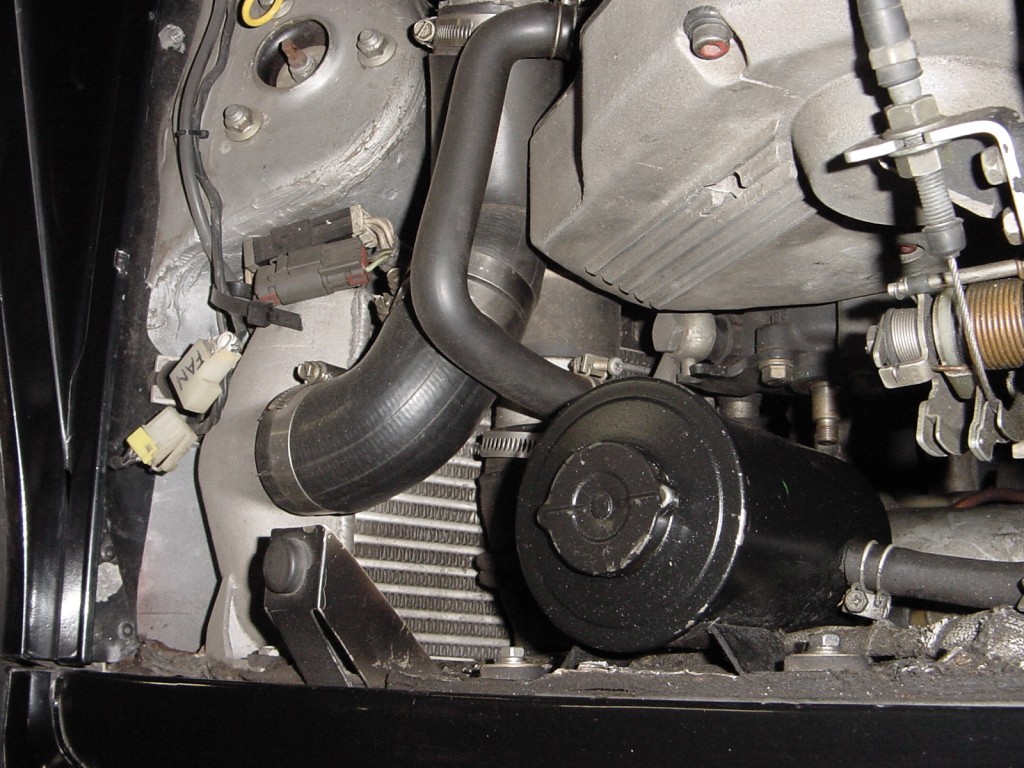 Fan is disconnected and power steering pump has no pulley.... Nissan is weird.